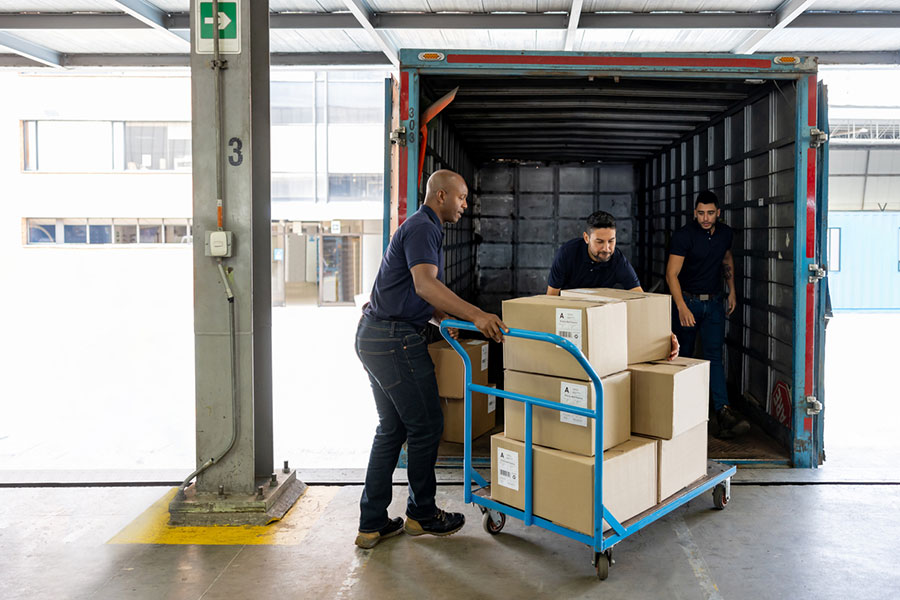 Men Loading a Truck With Boxes