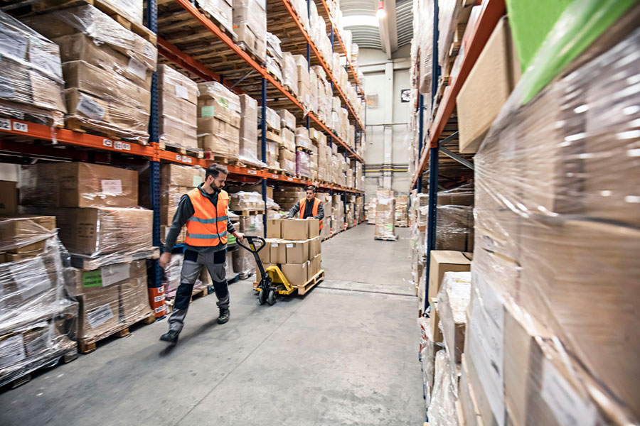 Warehouse Worker with Pallet Truck